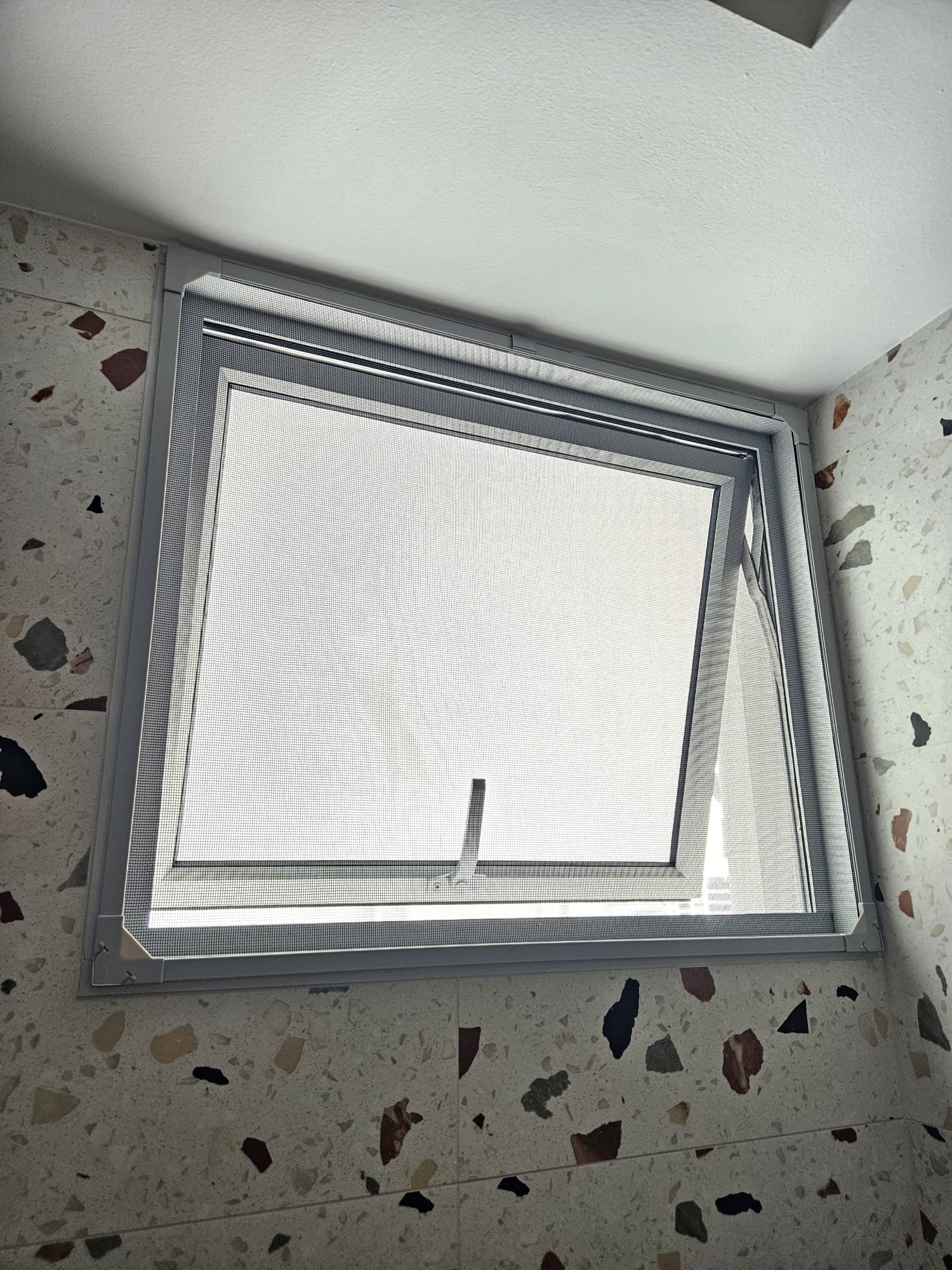 Magnetic window mesh installed in service yard window area